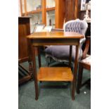 AN OCTAGONAL SHAPED SIDE / OCCASSIONAL TABLE, with square splayed legs united by a lower shelf,