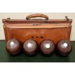 A SET OF 4 JAQUES & SON (LONDON) LAWN BOWLING BALLS, numbered 1,2,3 & 4 and initials A.W.B, with