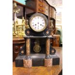 A LATE 19TH CENTURY SLATE & MARBLE MANTLE CLOCK, with reeded pillars and brass pendulum behind a
