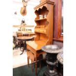 A SMALL KITCHEN / HALL DRESSER / STAND, with lift top slope front and raised shelved back, with