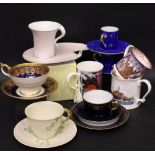 A COLLECTION OF CUPS & MUGS, includes; (i) A Belleek Basket & Shamrock cup & saucer, (ii) An Aynsley