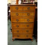 GOOD MAPLE WOOD BOW-FRONTED SEVEN DRAWER CHEST ON CABRIOLE LEG, having swan neck drop brass handles,