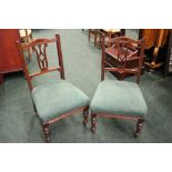 A PAIR OF LOW RISE 'NURSING' CHAIRS, with carved crest rail and pierced splat backs, raised on