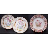 THREE 18TH CENTURY CHINESE EXPORT FAMILLE ROSE PLATES, A pair with floral decoration to the centre