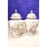 A LARGE PAIR OF LIDDED GINGER JAR, with images of figures amongst trees and blossoms