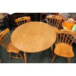 A 'COUNTRY KITCHEN' STYLE DINING SET, includes circular table, raised on turned leg, with (4)