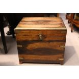 A BRASS BOUND CELLARETTE BOX, with hinged lid, and short splayed feet, 18.5" x 15" x 16" approx