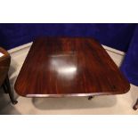 A LOW RISE MAHOGANY COFFEE TABLE, 19th century, raised on a four leg base, with brass toes, 56" x