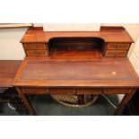 A STRING INLAID DESK, with raised back gallery having a central shelf with a pair of drawers on