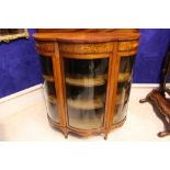 A VERY FINE BOW FRONTED DISPLAY CABINET, decorated to the frieze with inlaid motif of cherubs,