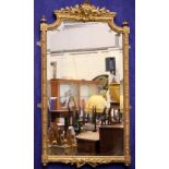 A VERY FINE 19TH CENTURY FRENCH GILT WALL MIRROR, with bevelled glass, decorated with floral and