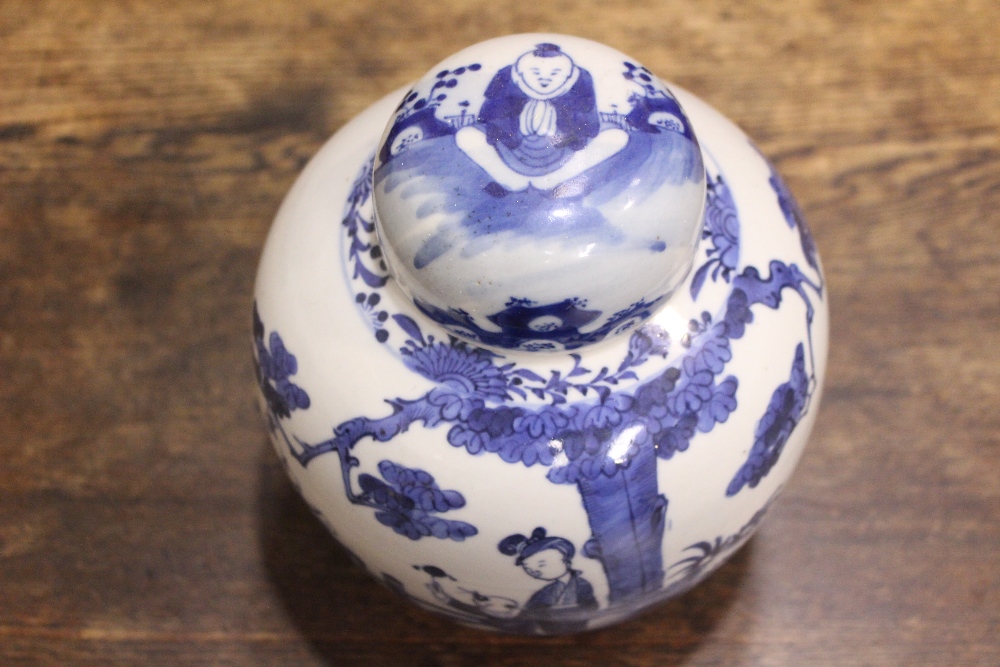 A BLUE & WHITE GINGER JAR with lid, decorated with images of children and a woman playing in a - Image 3 of 7