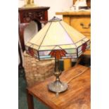 A TIFFANY STYLE TABLE LAMP, with coloured glass shade, having art deco style angular glass shade and