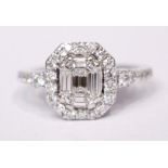 AN 18CT WHITE GOLD BAGUETTE & BRILLIANT CUT DIAMOND CLUSTER RING, 1.00cts.