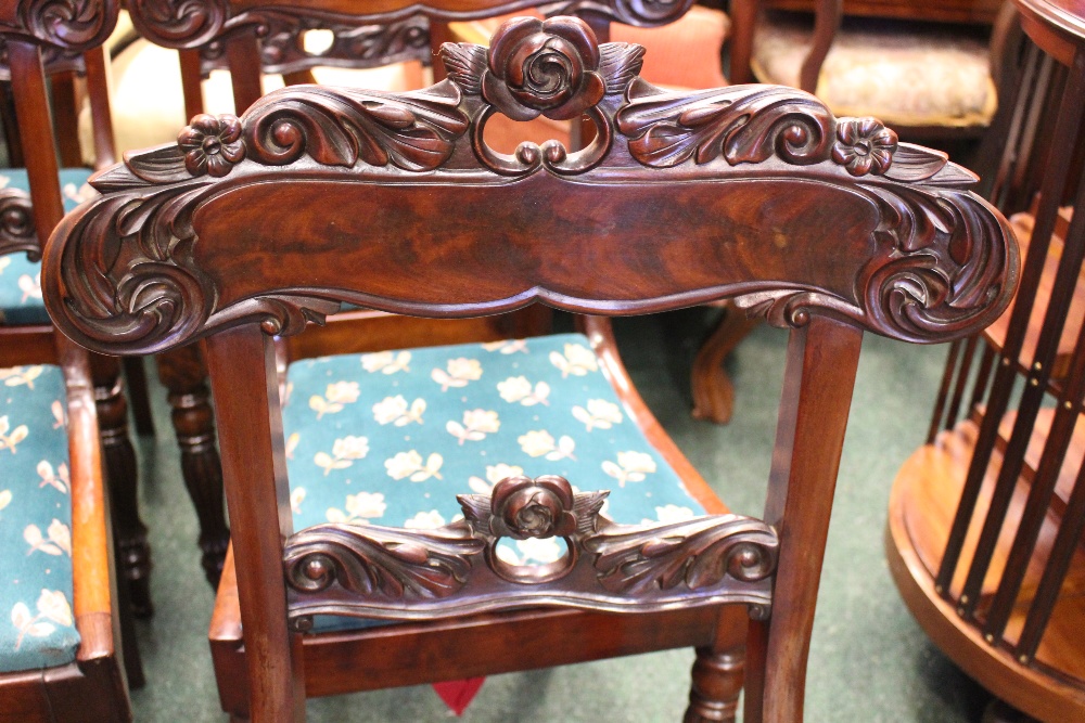 A SET OF 6 MAHOGANY REGENCY DINING ROOM CHAIRS, with lift up seats, and carved rose motif backs, - Image 3 of 4