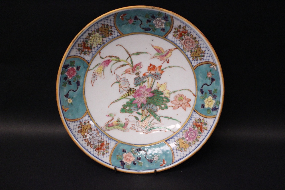 A FAMILLE ROSE PLATE, with cartouche border with floral decoration, the centre image of birds