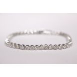 AN 18CT WHITE GOLD DIAMOND TENNIS BRACELET