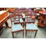 A SET OF 6 MAHOGANY REGENCY DINING ROOM CHAIRS, with lift up seats, and carved rose motif backs,