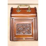 AN EARLY 20TH CENTURY MAHOGANY COAL / LOG BOX, with lift up top decorated with carved foliage motif,