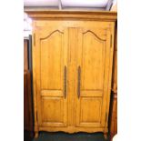 A LARGE 2 DOOR WARDROBE, with rail inside, raised on short splayed legs, 86" x 56" x 25" approx