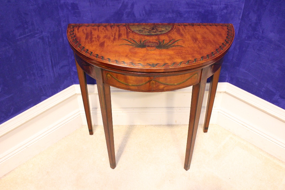 A DEMI LUNE SATINWOOD FOLD OVER CARD TABLE, decorated with hand painted motif of foliage and cherubs - Image 2 of 3