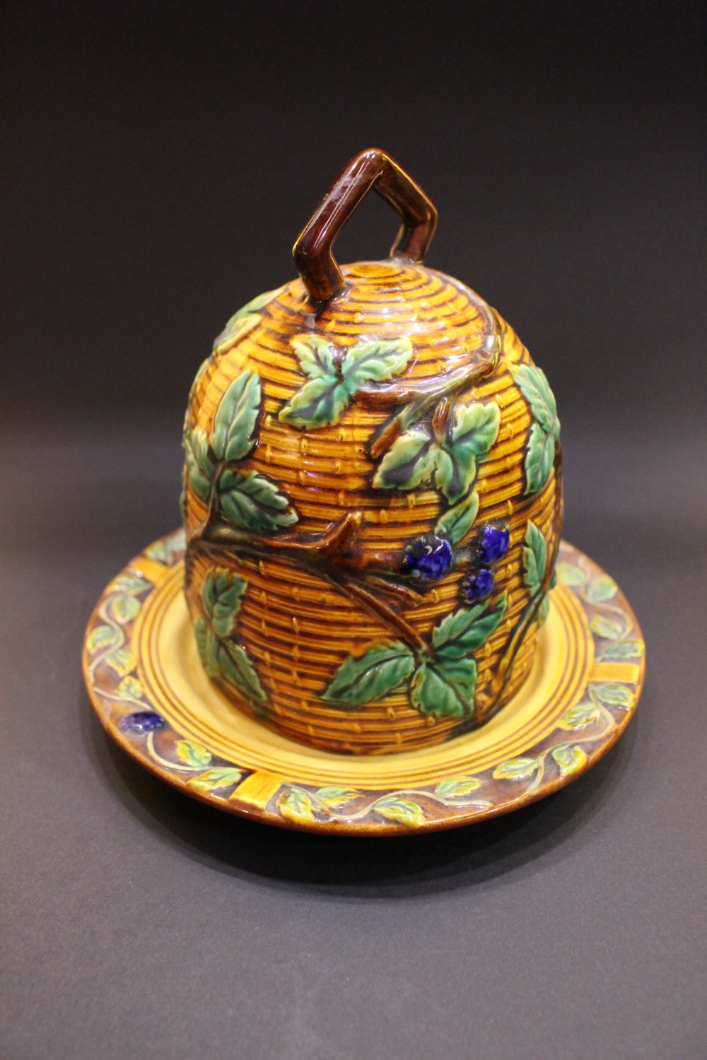 A MAJOLICA STYLE CHEESE DOME, with basket weave design, and berry & leaf decoration, 6.5" tall and - Image 2 of 3