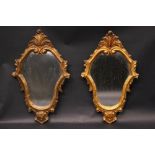 A PAIR OF GILT WALL MIRRORS, with foliage & scroll details, 14.25" x 8.5" approx