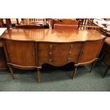 A SERPENTINE SHAPED SIDE BOARD, with 3 central drawers, flanked by a cabinet on each side, shelved