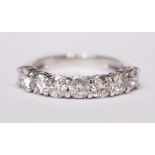 AN 18CT WHITE GOLD 7 STONE DIAMOND RING, 1.42cts.