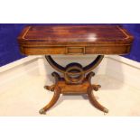 A VERY FINE REGENCY ROSEWOOD CROSS-BANDED FOLD OVER CARD TABLE, with brass inlaid detailing,