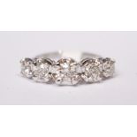 AN 18CT GRADUATED 5 STONE DIAMOND RING,1.14 cts. diamonds