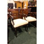 A PAIR OF REGENCY STYLE 'CARVER' ARMCHAIRS, with broad back supports, carved crest rails, with