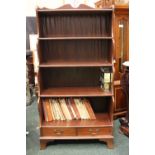 A 20TH CENTURY 'WATERFALL' BOOKCASE, with 5 shelves over 2 drawers, raised on splayed feet, with