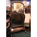 A VICTORIAN CHEVAL STANDING MIRROR, mahogany, with box framed mirror, raised on a pair of foliate