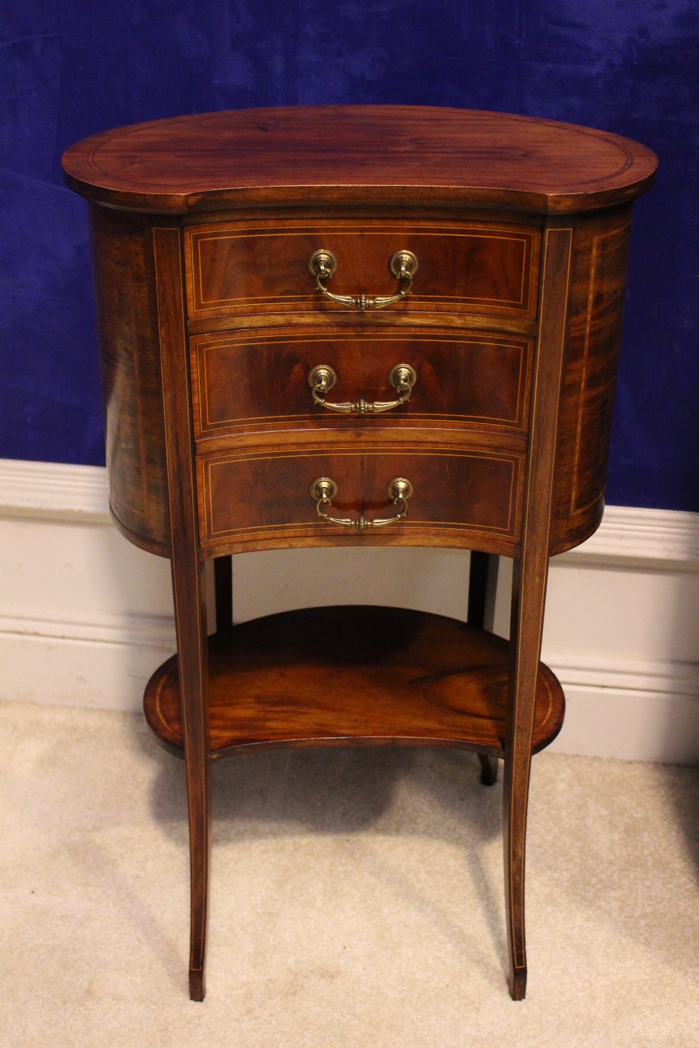 AN EDWARDIAN INLAID KIDNEY SHAPED SIDE CABINET, with single drawer of a 1 door marble lined cabinet,