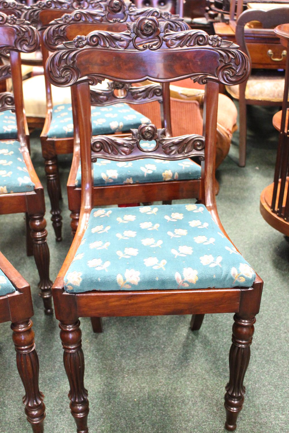 A SET OF 6 MAHOGANY REGENCY DINING ROOM CHAIRS, with lift up seats, and carved rose motif backs, - Image 2 of 4