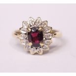 A 9CT YELLOW GOLD RING, with diamond & ruby setting