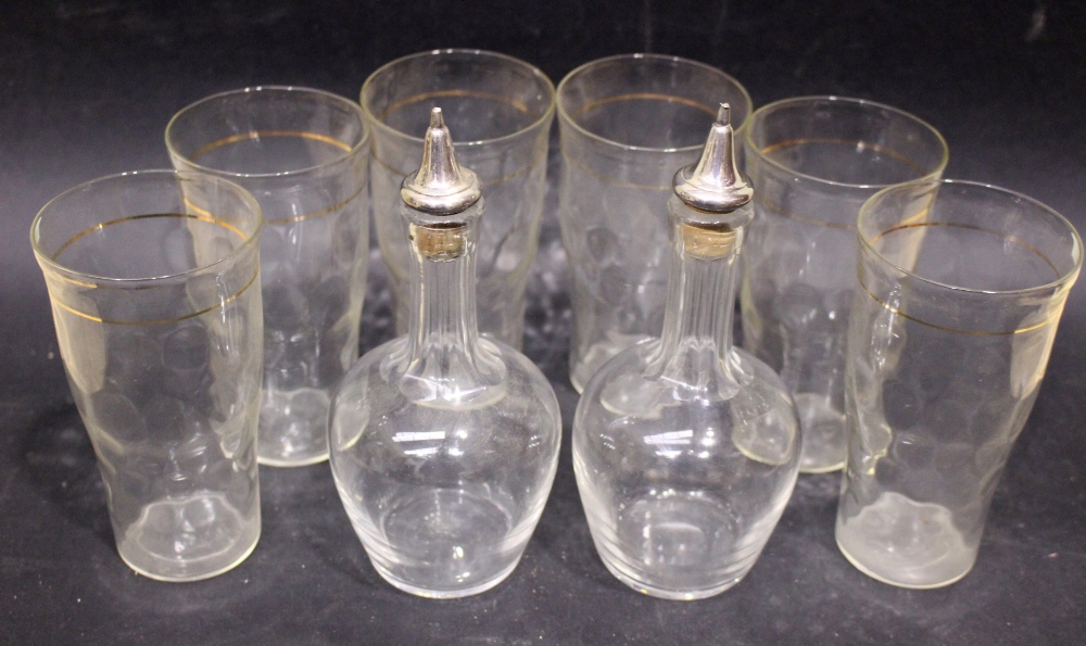 A SET OF 6 GLASSES & A PAIR OF GLASS VINEGARETTE BOTTLES, having silver plated cork stoppers, each