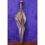 A LADY'S PARASOL / UMBRELLA, with carved duck head handle, by the maker H. Johnson Ltd, 25" long,