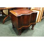 A SERPENTINE FRONTED 'COMMODE', with porcelain bowl and lid, raised on turned legs, 18" x 16" x