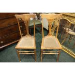 A PAIR OF CHAIRS, with pierced splat backs, tapered legs united by turned bar stretchers, 38" x