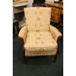 A PARKER KNOLL 'FOXFIELD' ARM CHAIR / SIDE CHAIR, with cushioned seat, raised on rounded leg, curved