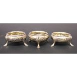 A SET OF 3 19TH CENTURY SALT CELLARS / CAULDRONS, each decorated with floral embossed design, and