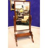 A FINE WILLIAM IV CHEVAL MIRROR, with inlaid detail to the frame and base, a pair of scroll shaped