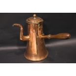 A COPPERWARE KETTLE, with hinged lid, and turned wooden handle, 11.25" tall approx