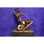 A BRONZE SCULPTURE OF A RECLINING NUDE, embossed with stamp beneath and numbered 2/8, "Fonderie
