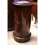 A LATE 19TH CENTURY CYLINDRICAL CABINET, with hinged marble top, a curved single door to the body