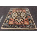 A FLOOR RUG, with blue, orange & cream ground, Belgian made, 91" x 62" approx