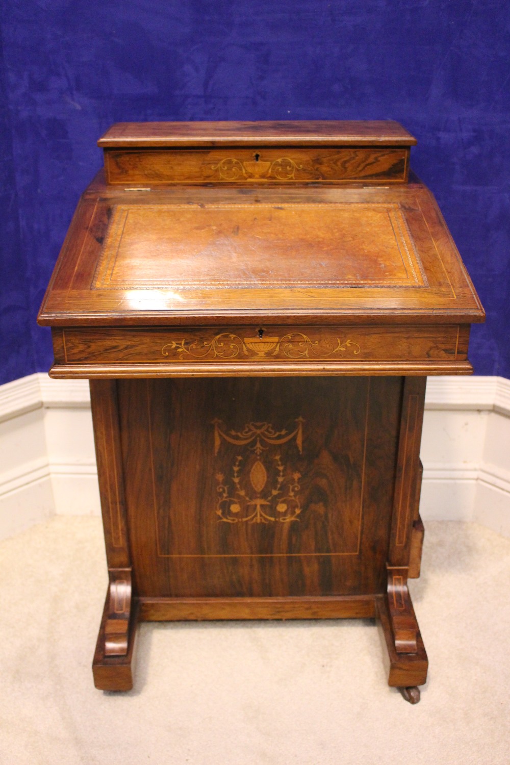 A VERY FINE ROSEWOOD INLAID DAVENPORT, with lift up leather topped writing slope, a raised back with