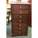 A TALL BOY / CABINET, 7 drawers, each with brass ring pulls, raised on bracket feet, 41" x 21" x 15"